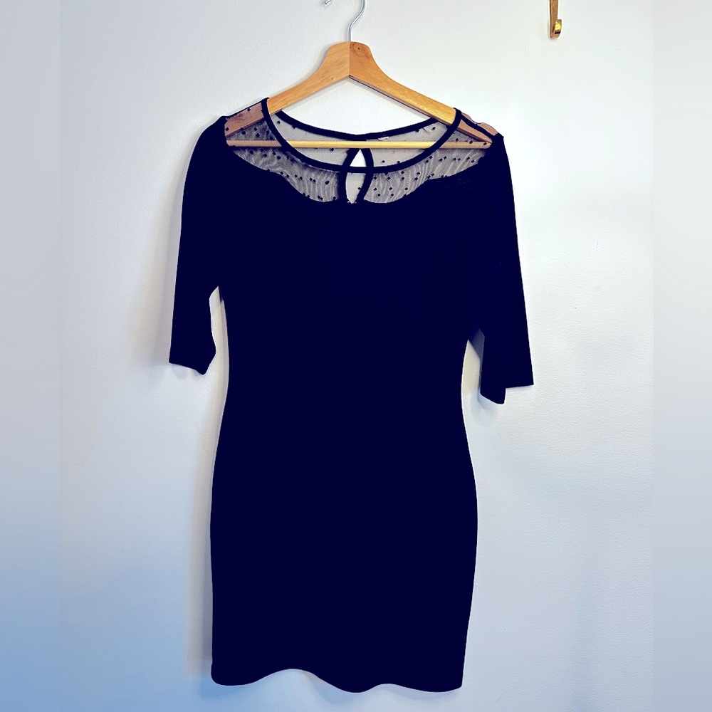 LBD with sheer trim and back zip.